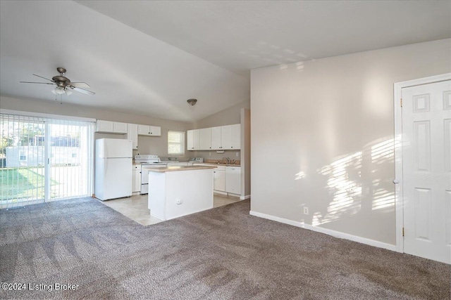 kitchen featuring white appliances, ceiling fan, a kitchen island, light colored carpet, and white cabinetry