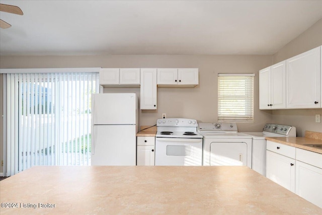 kitchen featuring separate washer and dryer, ceiling fan, white cabinets, and white appliances