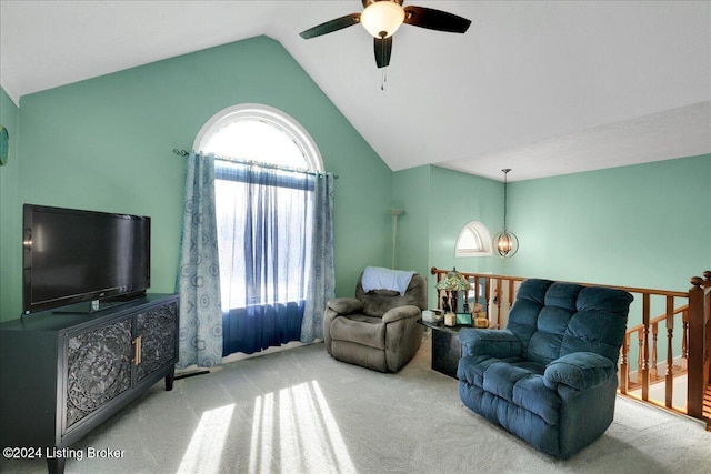 living room featuring plenty of natural light, carpet, and vaulted ceiling