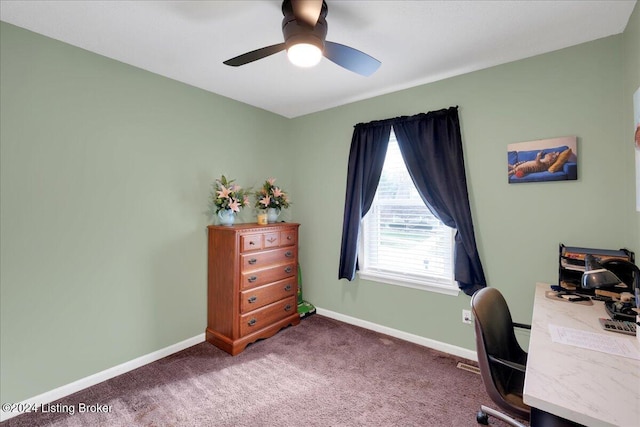 office space featuring ceiling fan and dark colored carpet