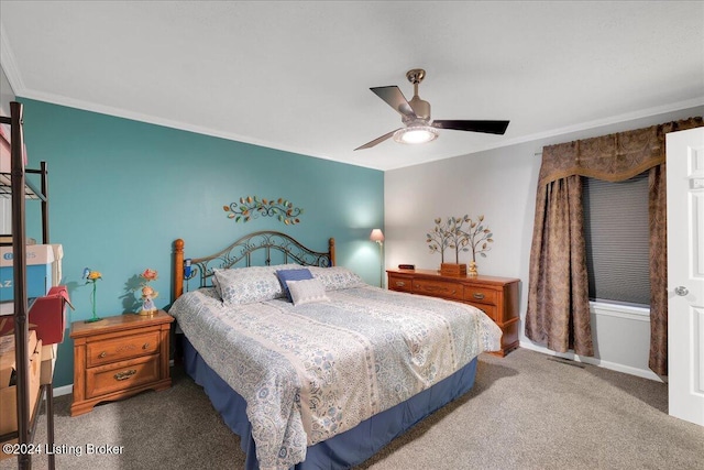 carpeted bedroom with crown molding and ceiling fan