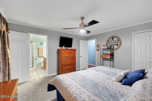 bedroom featuring crown molding, carpet floors, ceiling fan, and a closet