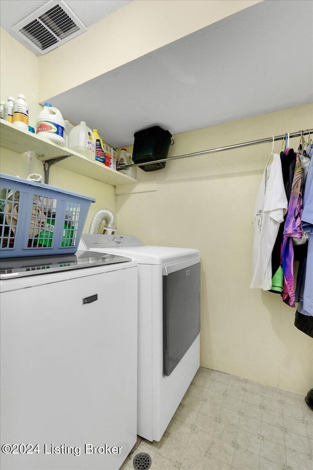 washroom with washer and clothes dryer