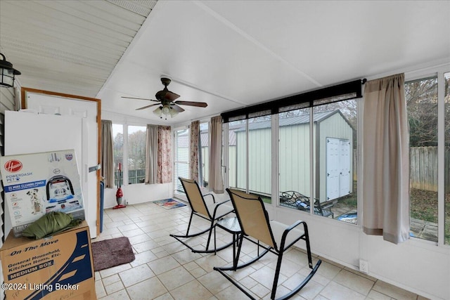 sunroom with plenty of natural light and ceiling fan