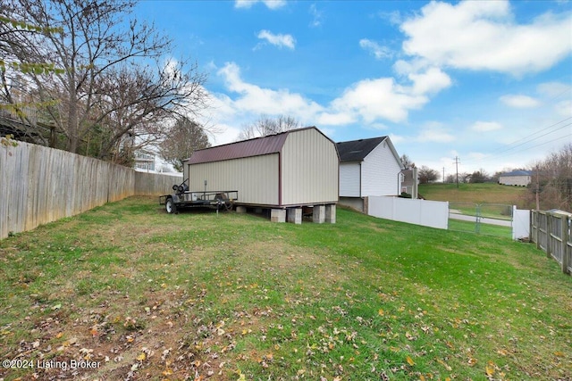 rear view of property featuring a yard