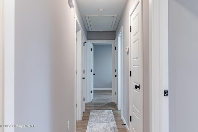 hall with light hardwood / wood-style floors