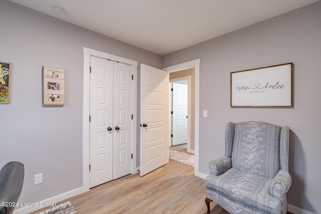 living area with light hardwood / wood-style floors