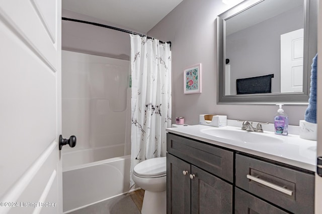 full bathroom with shower / bath combination with curtain, vanity, and toilet