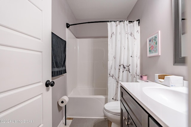 full bathroom with vanity, shower / tub combo, and toilet