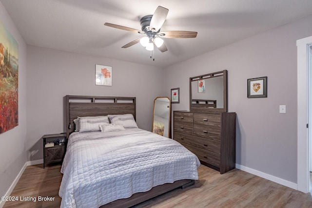 bedroom featuring light wood-type flooring and ceiling fan