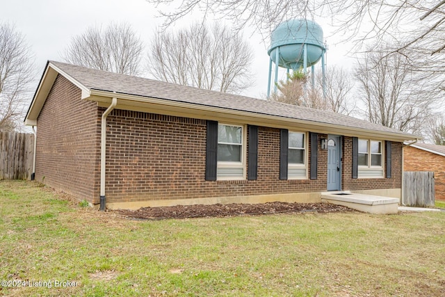 ranch-style home with a front lawn