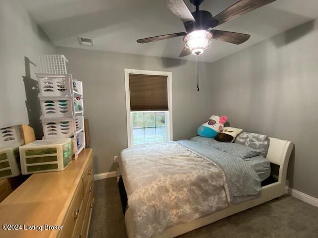 bedroom featuring dark carpet and ceiling fan