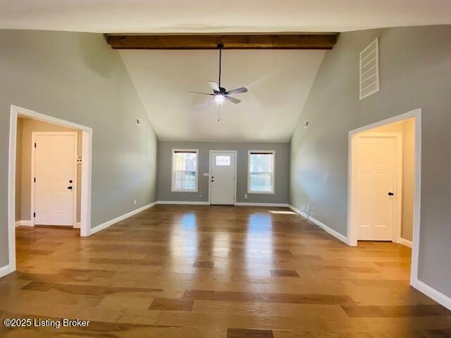 entryway featuring visible vents, baseboards, beamed ceiling, and wood finished floors