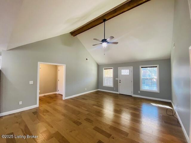 interior space with baseboards, beam ceiling, wood finished floors, high vaulted ceiling, and a ceiling fan