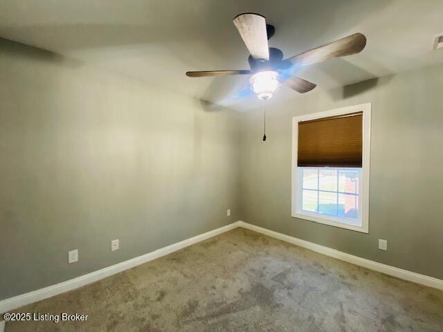 unfurnished room featuring carpet flooring, visible vents, baseboards, and ceiling fan