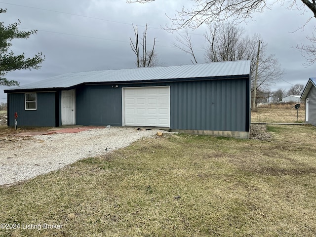 garage featuring a yard