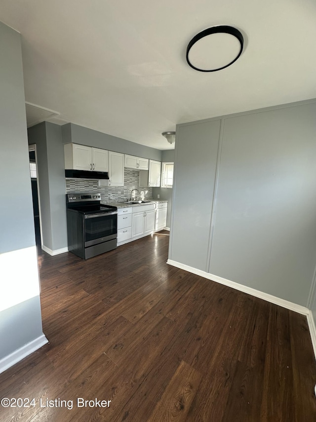 kitchen with white cabinets, sink, electric stove, and dark wood-type flooring