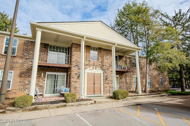 view of front of house with a balcony