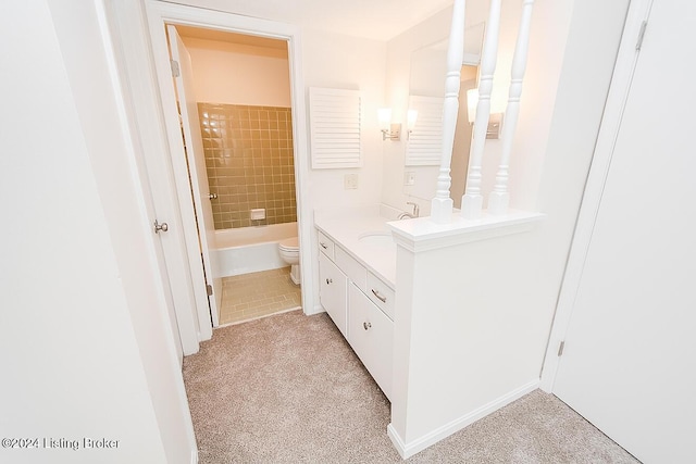 full bathroom with vanity, toilet, and tiled shower / bath