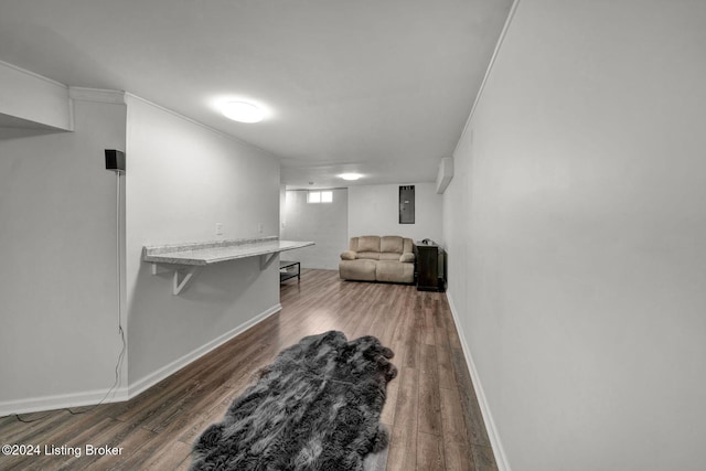 interior space featuring ornamental molding and dark wood-type flooring