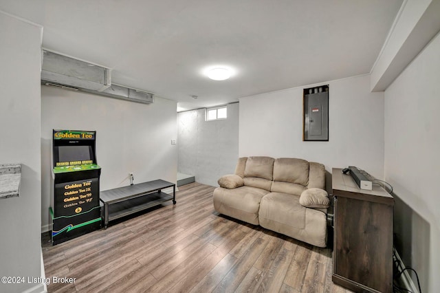 living room featuring hardwood / wood-style flooring and electric panel