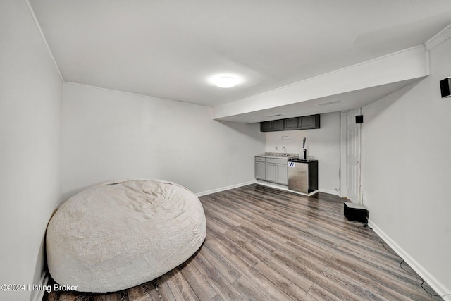 sitting room with hardwood / wood-style flooring