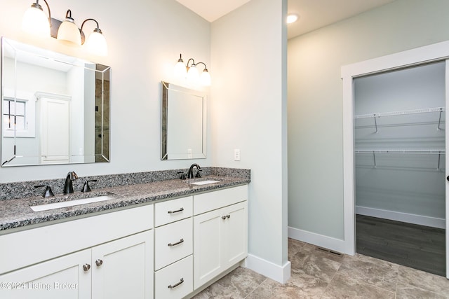 bathroom with hardwood / wood-style floors and vanity