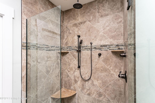 bathroom with tiled shower