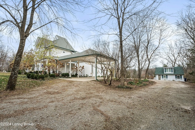 view of property exterior featuring a carport