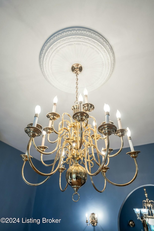 interior details featuring a notable chandelier