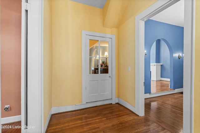 hallway featuring dark wood-type flooring