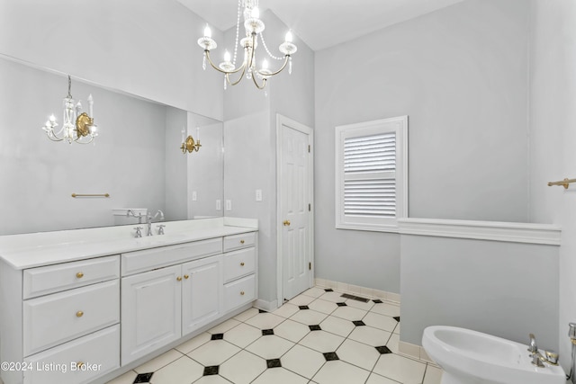 bathroom featuring a notable chandelier, a bidet, and vanity