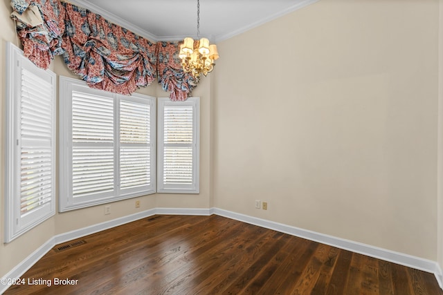 unfurnished dining area featuring crown molding, hardwood / wood-style flooring, and a notable chandelier