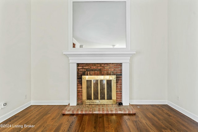 unfurnished living room with a fireplace and hardwood / wood-style flooring