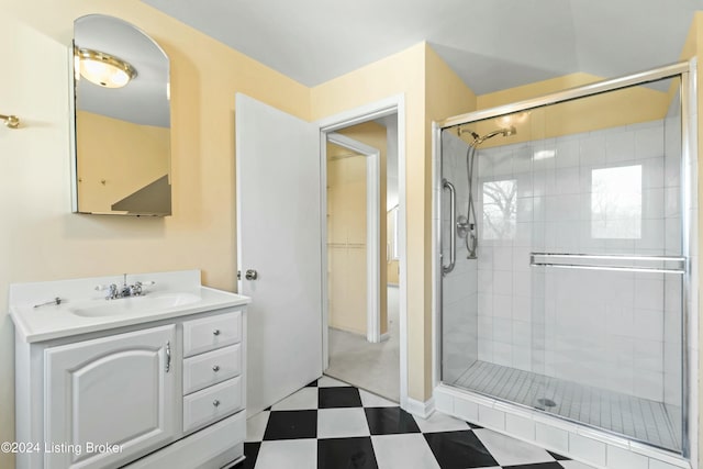 bathroom featuring vanity and an enclosed shower