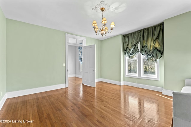 interior space featuring a chandelier and hardwood / wood-style floors