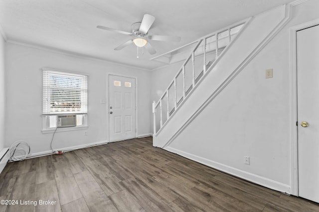 entrance foyer with ceiling fan, cooling unit, ornamental molding, and hardwood / wood-style flooring