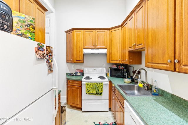 kitchen featuring white appliances and sink