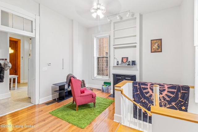 interior space featuring hardwood / wood-style floors and ceiling fan