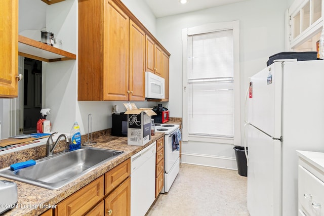 kitchen with white appliances and sink