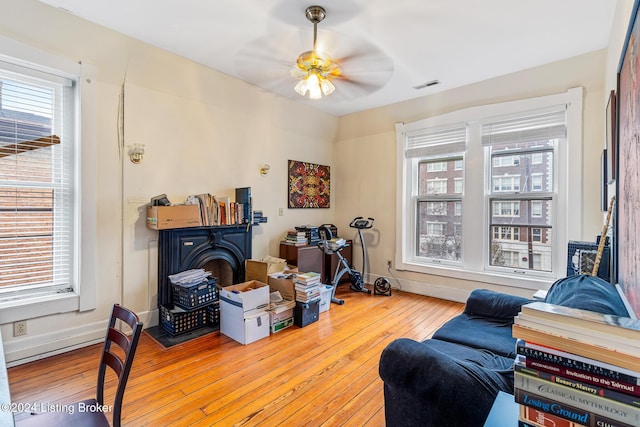 interior space featuring ceiling fan, a healthy amount of sunlight, and light hardwood / wood-style floors