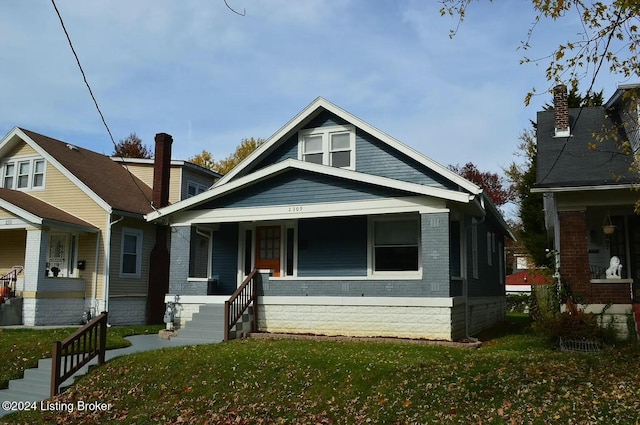 bungalow-style house featuring a front yard and a porch