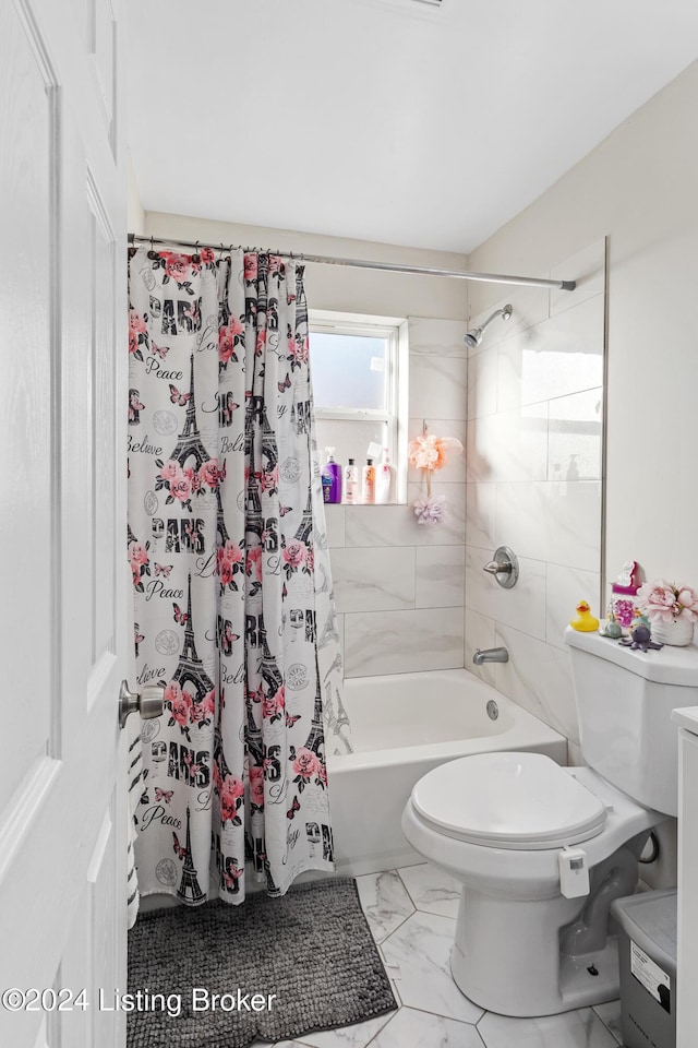 bathroom with shower / tub combo and toilet