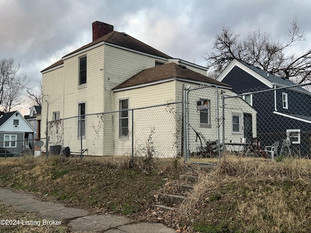 view of side of property featuring cooling unit