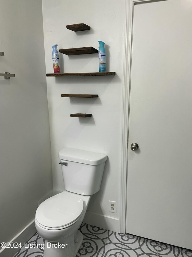 bathroom with tile patterned floors and toilet