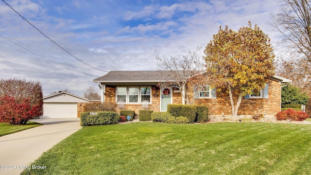 view of front of property featuring a garage and a front lawn