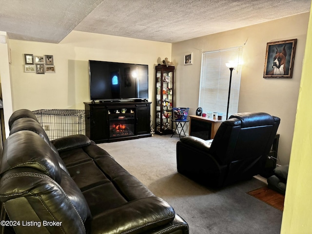 carpeted living room featuring a fireplace and a textured ceiling