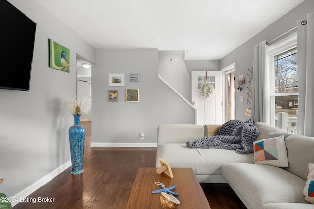 living room with dark hardwood / wood-style flooring