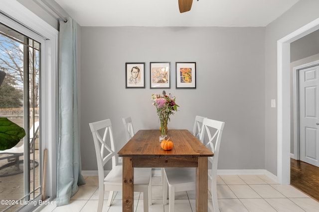 dining room with ceiling fan and light hardwood / wood-style floors