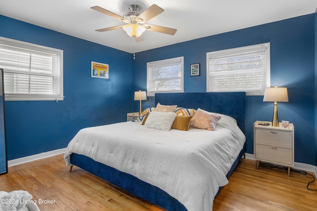 bedroom featuring light hardwood / wood-style floors and ceiling fan